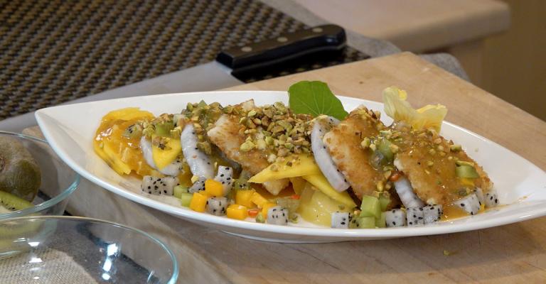 Pan-fried fish with Pistachio & Fruit slices